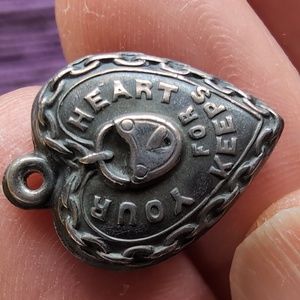 Antique sterling silver puffed heart charm